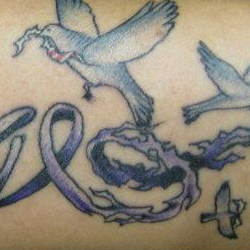 Tattoo of doves with text