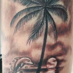 Tattoo of palm tree on the beach
